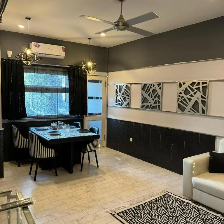 GreenLux Residency shared lounge and dining space